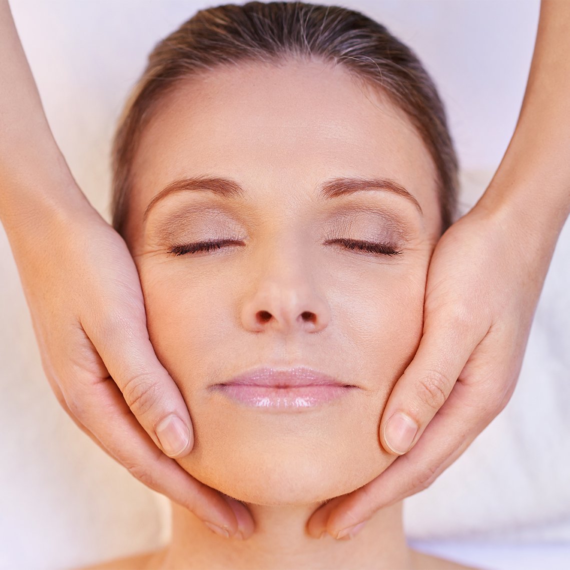 Woman receiving a facial treatment